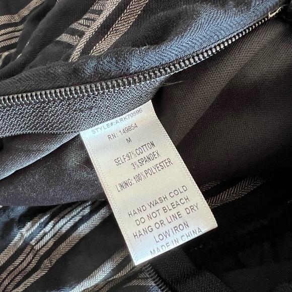 Sadie & Sage Black and Cream Jumpsuit with Peekaboo Detail and Front Tie Striped - Picture 7 of 7